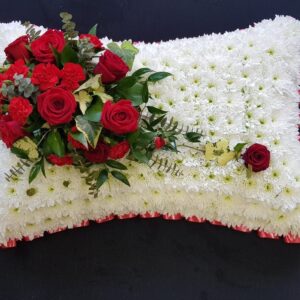Red roses and white flower funeral pillow tribute