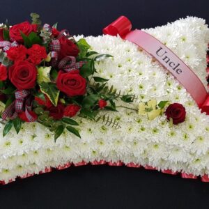 White chrysanthemum and red rose funeral pillow tribute