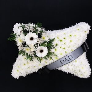 White funeral pillow tribute with flowers and DAD ribbon