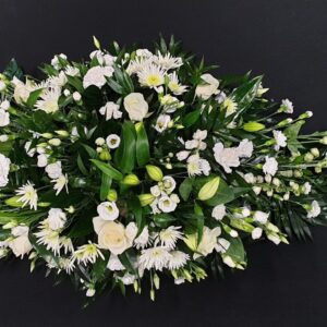 White lily, rose, and chrysanthemum funeral coffin spray