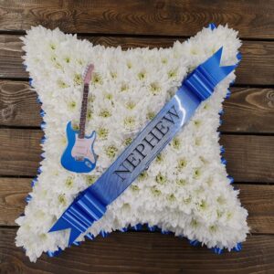 White chrysanthemum funeral cushion with blue accents