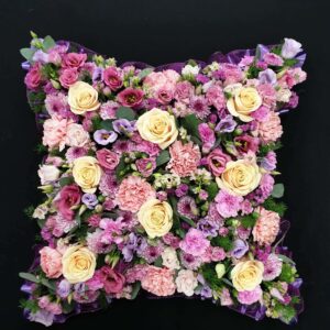 Pastel rose and carnation funeral cushion tribute