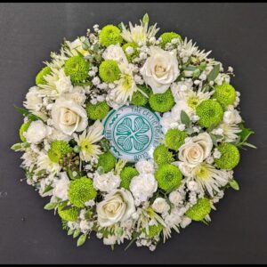 Celtic Football Club themed funeral wreath with green and white flowers.