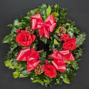 Christmas Holly Wreath 3 Festive holly wreath with red bows and pinecones