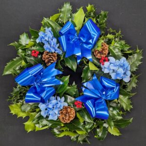 Christmas Holly Wreath 5 Holly wreath with blue ribbons and pinecones