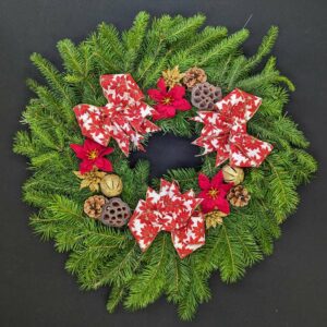 Christmas wreath with red bows and pinecones