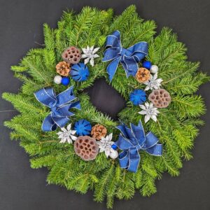 Christmas wreath with blue ribbons and silver accents