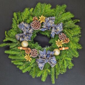 Elegant Christmas wreath with evergreens and decorations