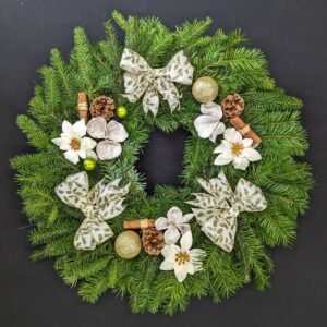 Elegant Christmas wreath with bows and pinecones
