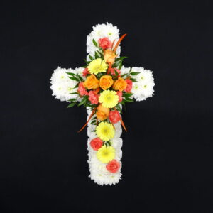 Vibrant mixed flower funeral cross tribute