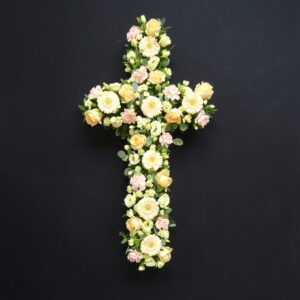 Peach and cream flower funeral cross tribute
