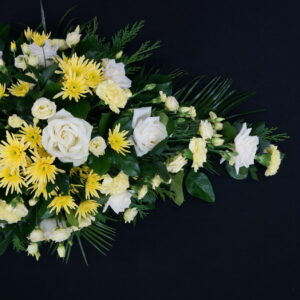 White and yellow funeral single ended spray with roses