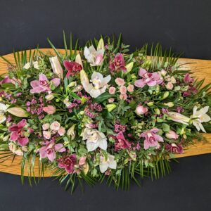 Pink and white floral funeral coffin spray arrangement