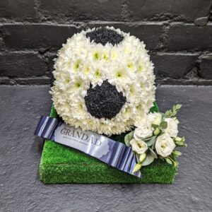 Floral football and white rose funeral tribute