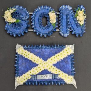 Scottish funeral flowers arrangement with tartan