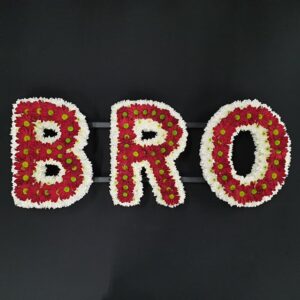 Letter tribute red and white flowers B R O