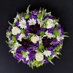 White and purple funeral posy with roses and chrysanthemums