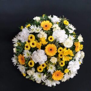 White and yellow funeral posy arrangement
