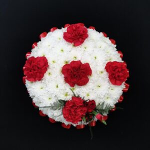 White chrysanthemum and red carnation funeral posy