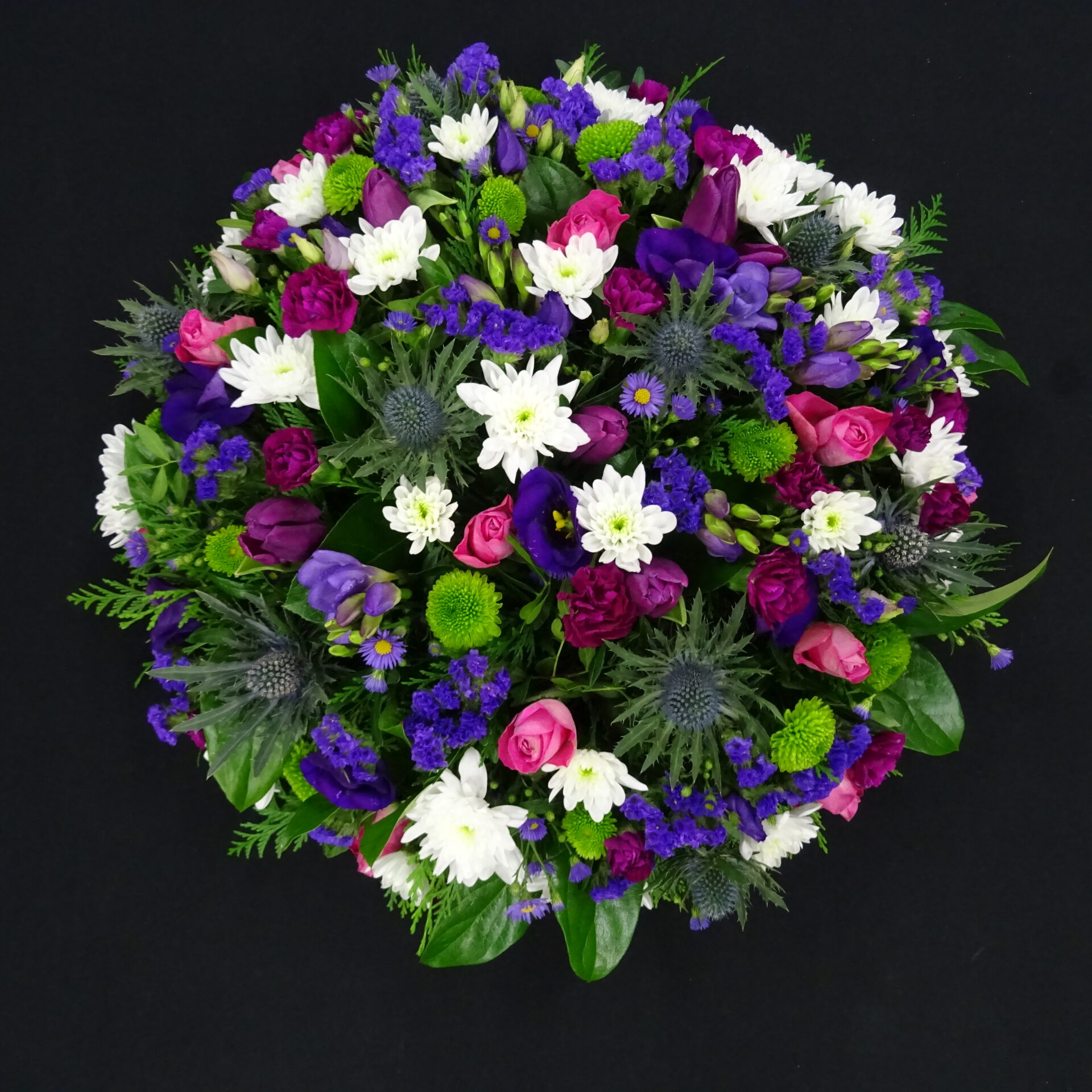 Posy 5 scaled Elegant funeral posy with white, purple, and green flowers