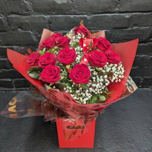 12 red rose bouquet with greenery and baby's breath