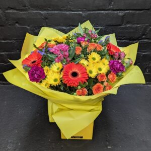 Sophia Bouquet Vibrant flower bouquet in yellow wrapping