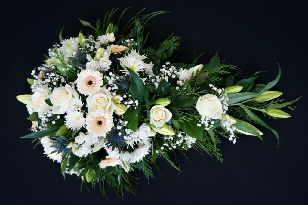 White Casket Flower Spray in Black Backround