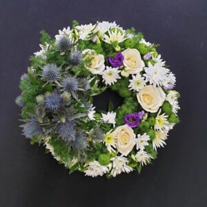 Funeral flower wreath with white roses and chrysanthemums