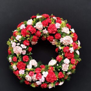 Red and pink carnation funeral wreath
