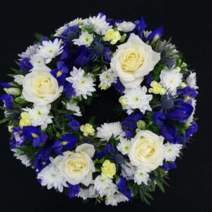 White and blue funeral wreath with roses