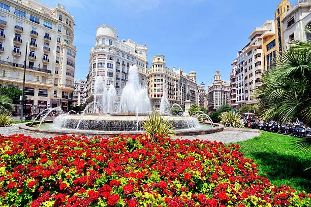 Beautiful red flowers in a park in a city